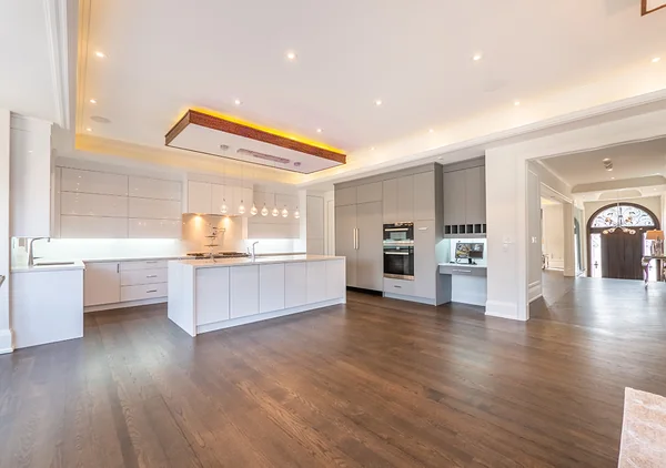 Bevdale Road: Wide view of the white kitchen and open family room