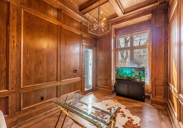 Bevdale Road: Wood-panelled study with built-in shelves and coffered ceiling