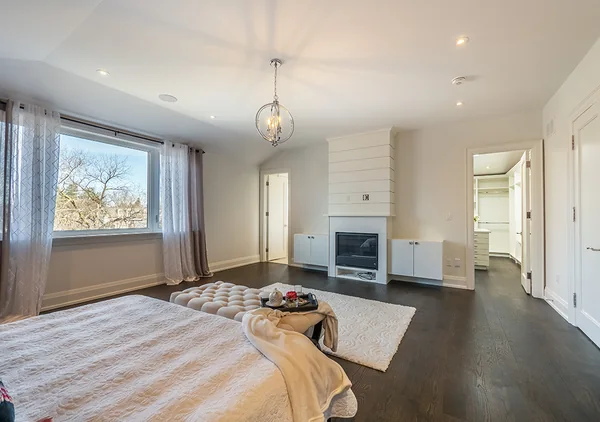 Bevdale Road: Bedroom seating area beside fireplace and large window