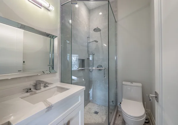 Bevdale Road: Bathroom with white vanity and glass shower enclosure