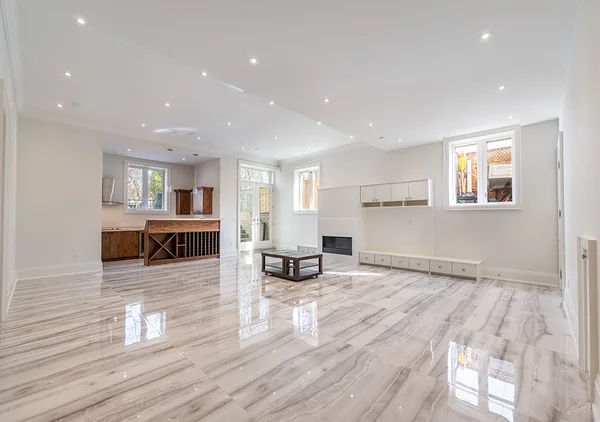 Bevdale Road: Lower-level living space with pale tile flooring and kitchenette