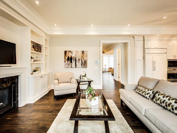 Joicey Boulevard 2: Family-room seating beside fireplace and built-in shelves