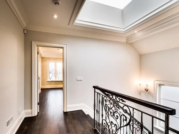 Joicey Boulevard 2: Upper landing with decorative metal railing beneath a skylight