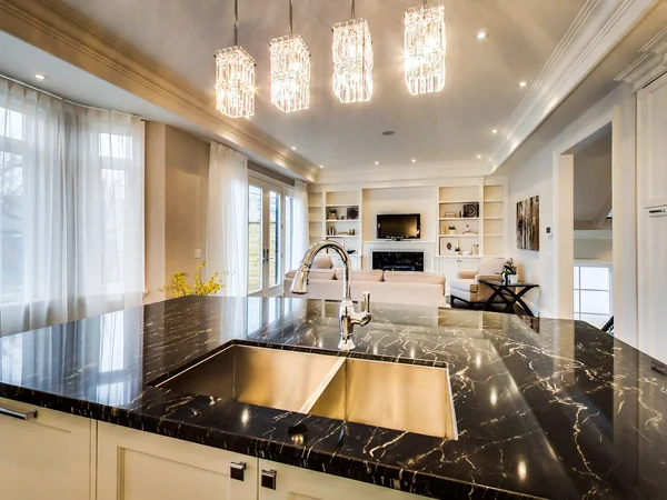 Joicey Boulevard 2: Dark stone kitchen island with double sink and pendant lights