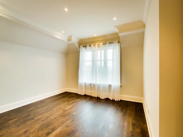 Joicey Boulevard 2: Empty bedroom with wood floor and large window