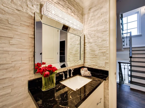Joicey Boulevard 2: Powder-room vanity with dark counter and stone-textured walls