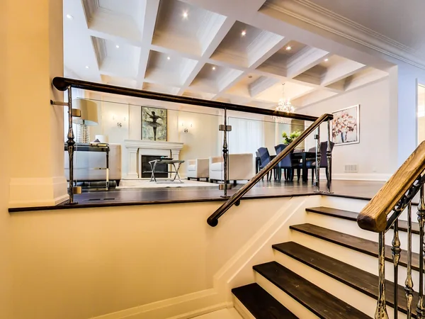 Joicey Boulevard 2: Staircase with metal railing beside the open living area