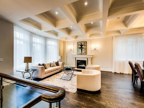 Joicey Boulevard 2: Living-room fireplace and seating beside the staircase
