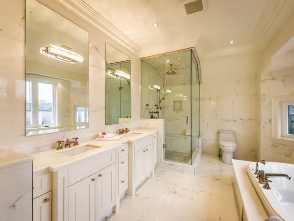 Joicey Boulevard 2: Bathroom double vanity beside a glass shower enclosure