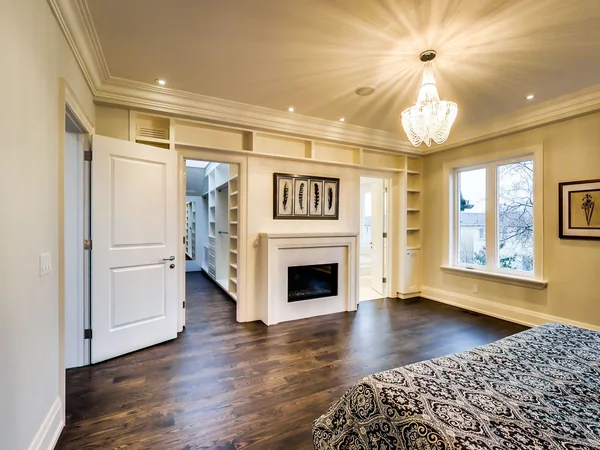 Joicey Boulevard 2: Bedroom fireplace surrounded by white built-in cabinetry