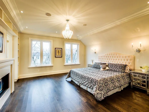 Joicey Boulevard 2: Bedroom with wood floor, large windows and upholstered bed