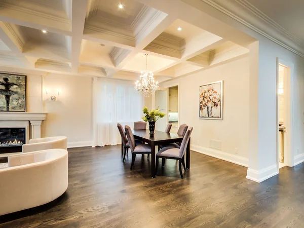 Joicey Boulevard 2: Dining table beneath a coffered ceiling beside the living area