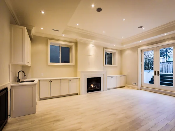 Joicey Boulevard 2: Lower-level living space with kitchenette, fireplace and rear doors