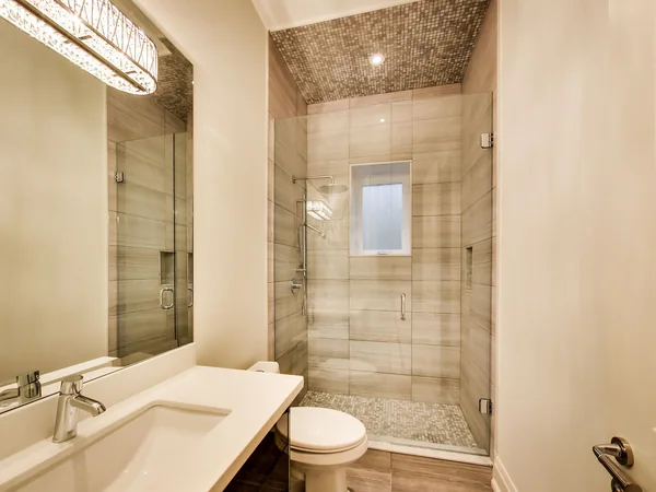 Joicey Boulevard 2: Bathroom with small vanity and tiled shower