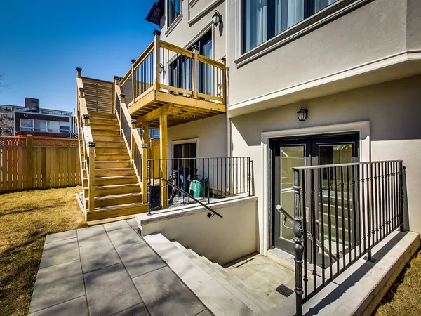Joicey Boulevard 2: Rear timber deck and stairs beside the lower-level entrance