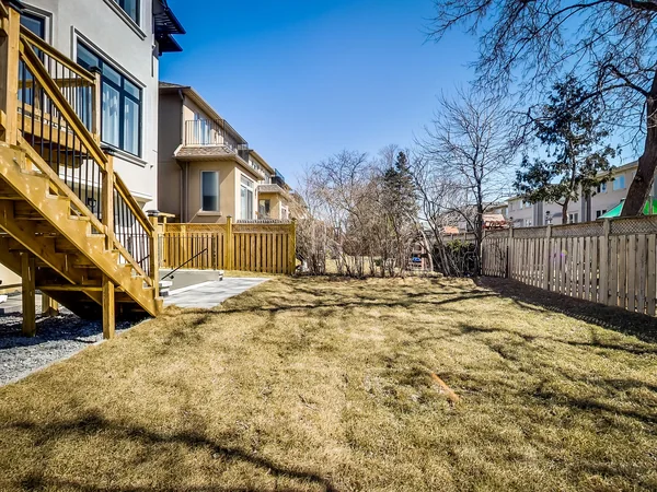 Joicey Boulevard 2: Rear lawn, timber deck and wooden perimeter fence