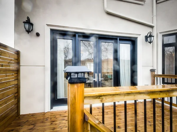 Joicey Boulevard 2: Glazed rear doors beside the timber deck railing