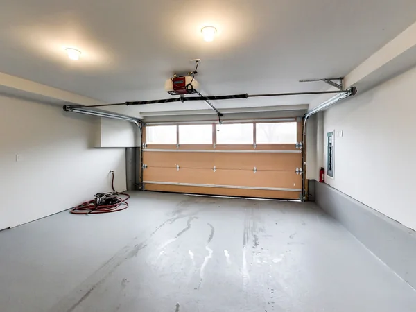 Joicey Boulevard 2: Garage interior with overhead door and pale floor