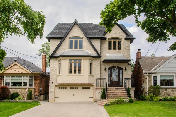 Joicey Boulevard: Front exterior with stone facade, garage and landscaped lawn