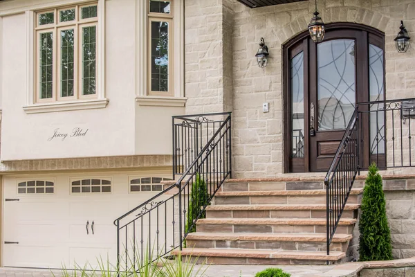 Joicey Boulevard: Stone front steps, metal railings and arched entrance door