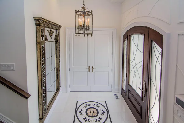 Joicey Boulevard: Entry hall with patterned tile floor and arched front door