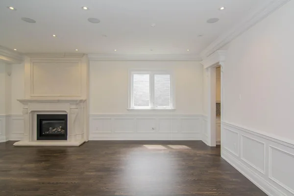 Joicey Boulevard: White fireplace surround and wall panelling in the living room