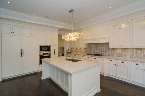 Joicey Boulevard: Kitchen island, integrated appliances and white cabinetry