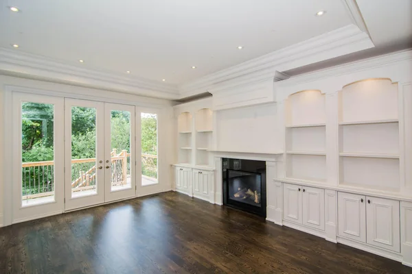 Joicey Boulevard: Family room with fireplace, built-in shelving and glazed rear doors