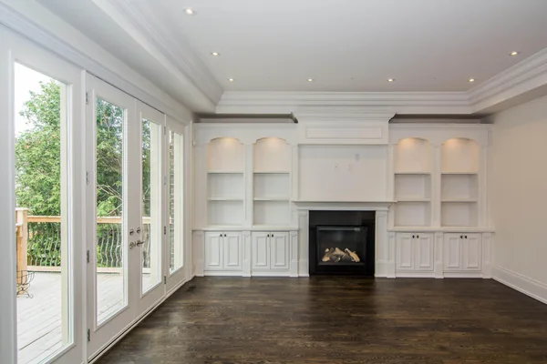 Joicey Boulevard: White built-in shelves and fireplace beside the rear windows