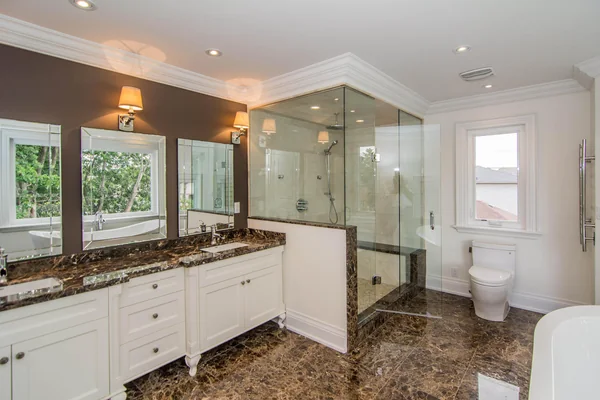 Joicey Boulevard: Bathroom with double vanity, stone tile and glass shower