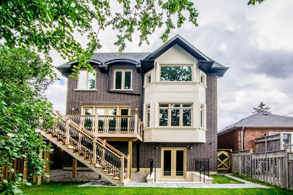 Joicey Boulevard: Rear exterior with timber deck, stairs and lawn