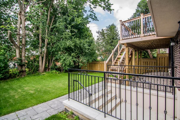 Joicey Boulevard: Rear garden and deck above a sunken paved entrance