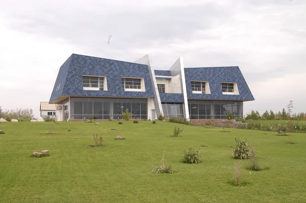 Kazakhstan–Kapchegai: Wide exterior view of the building and lawn