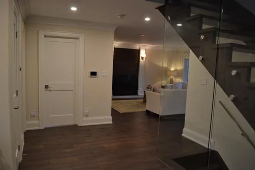 Nevada Avenue: Entrance hallway beside a staircase with glass balustrade