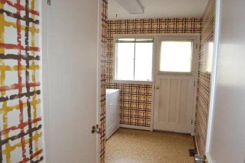 Nevada Avenue: Small rear room with patterned walls and a glazed door