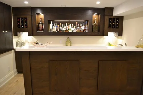 Nevada Avenue: Wood-fronted bar counter with illuminated cabinets