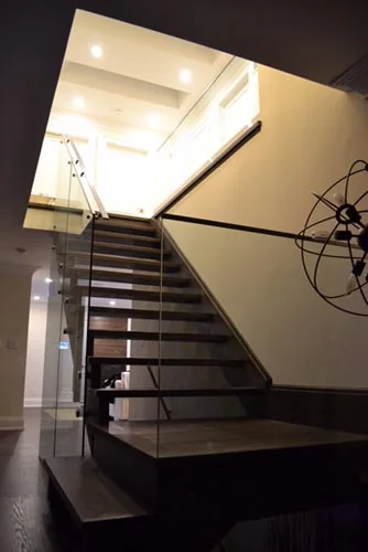 Nevada Avenue: Tall stairwell with wood treads and glass railing