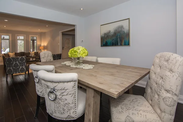 Tilman Circle: Dining table beside the open living room